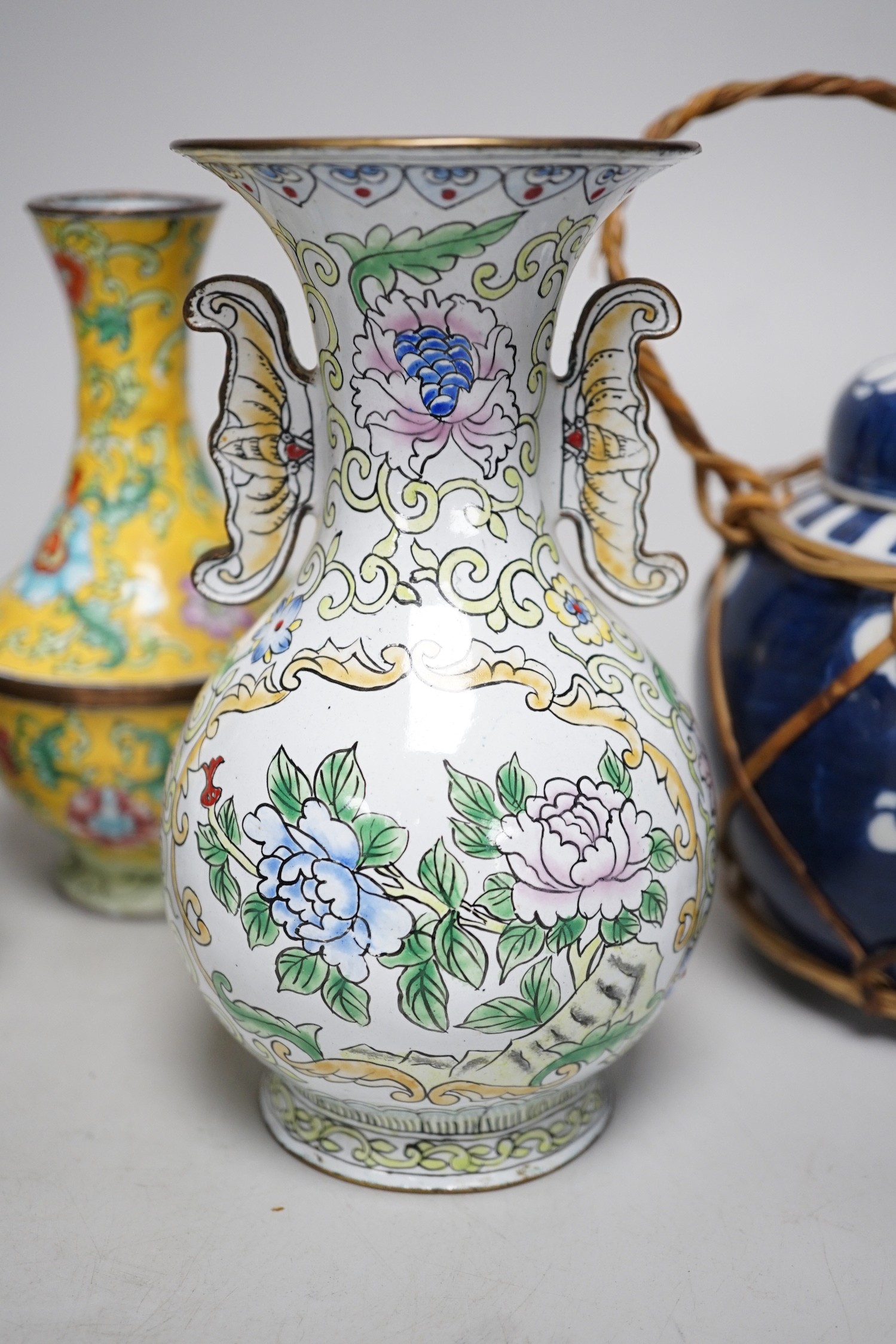 A group of Canton enamel vases, a pair of cloisonné enamel jars and a blue and white jar. Tallest 15.5cm